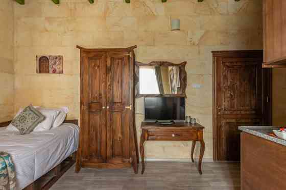 Каменная студия Cozy Rooms Goreme целиком UErguep