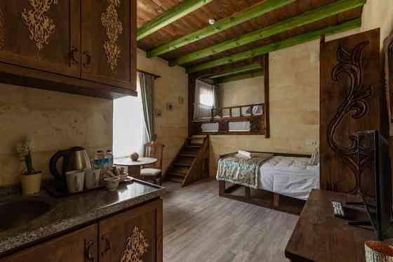 Каменная студия Cozy Rooms Goreme целиком UErguep