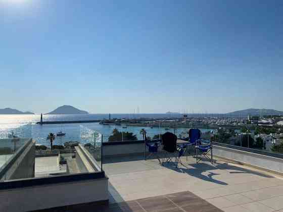 Апартаменты 3BR Terrace Apartment with Spectacular Sea View Turgutreis