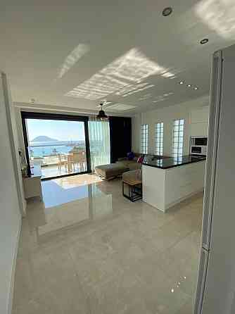 Апартаменты 3BR Terrace Apartment with Spectacular Sea View Turgutreis